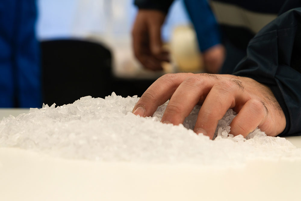 image of hand touching resins